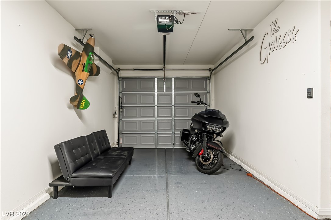 3807 Chapels Royal Street Laughlin, NV 89029 - Photo 41 of 62 Garage with baseboards and a garage door opener
