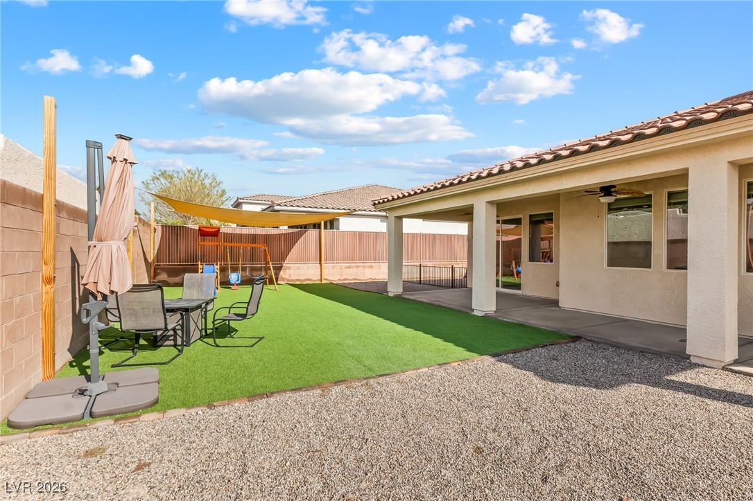 3807 Chapels Royal Street Laughlin, NV 89029 - Photo 45 of 62 Fenced backyard with a patio area and a ceiling fan