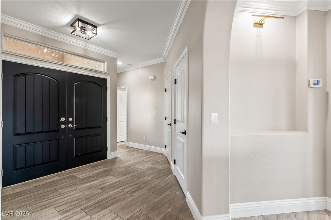3807 Chapels Royal Street Laughlin, NV 89029 - Photo 5 of 62 Entryway with ornamental molding and wood tiled floors