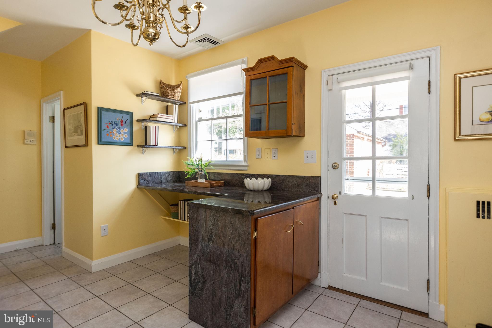 331 Broxton Road Baltimore, MD 21212 - Photo 13 of 58 a view of a kitchen area with furniture and a window