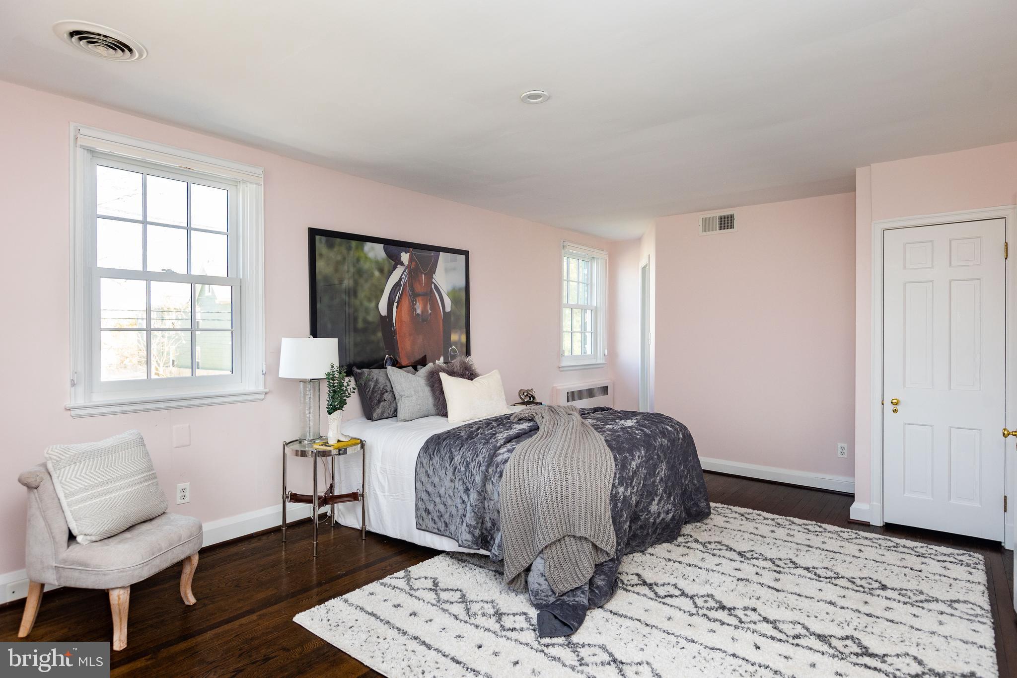 331 Broxton Road Baltimore, MD 21212 - Photo 31 of 58 a bedroom with a bed and wooden floor