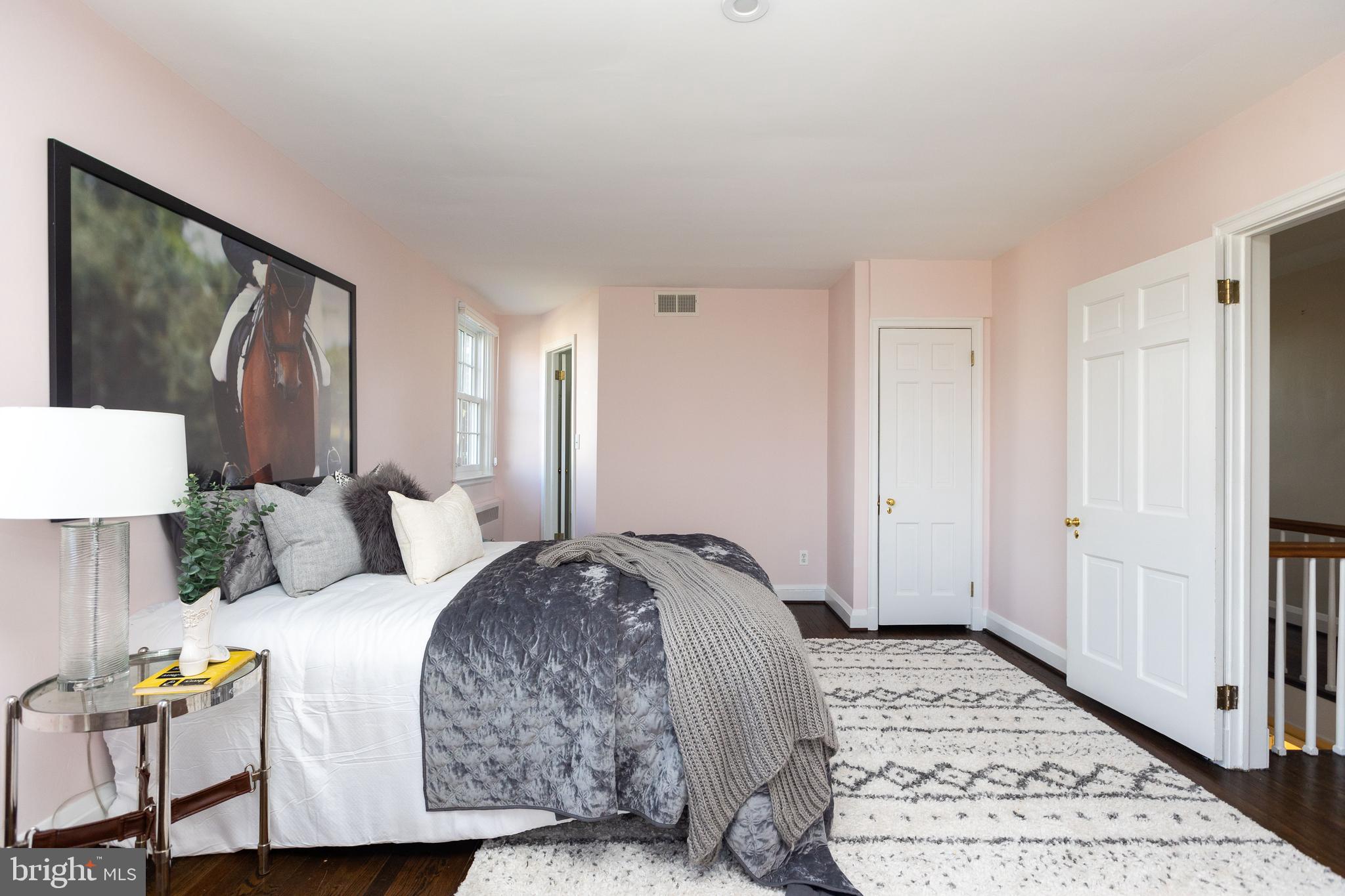 331 Broxton Road Baltimore, MD 21212 - Photo 32 of 58 a bedroom with a bed mirror and window