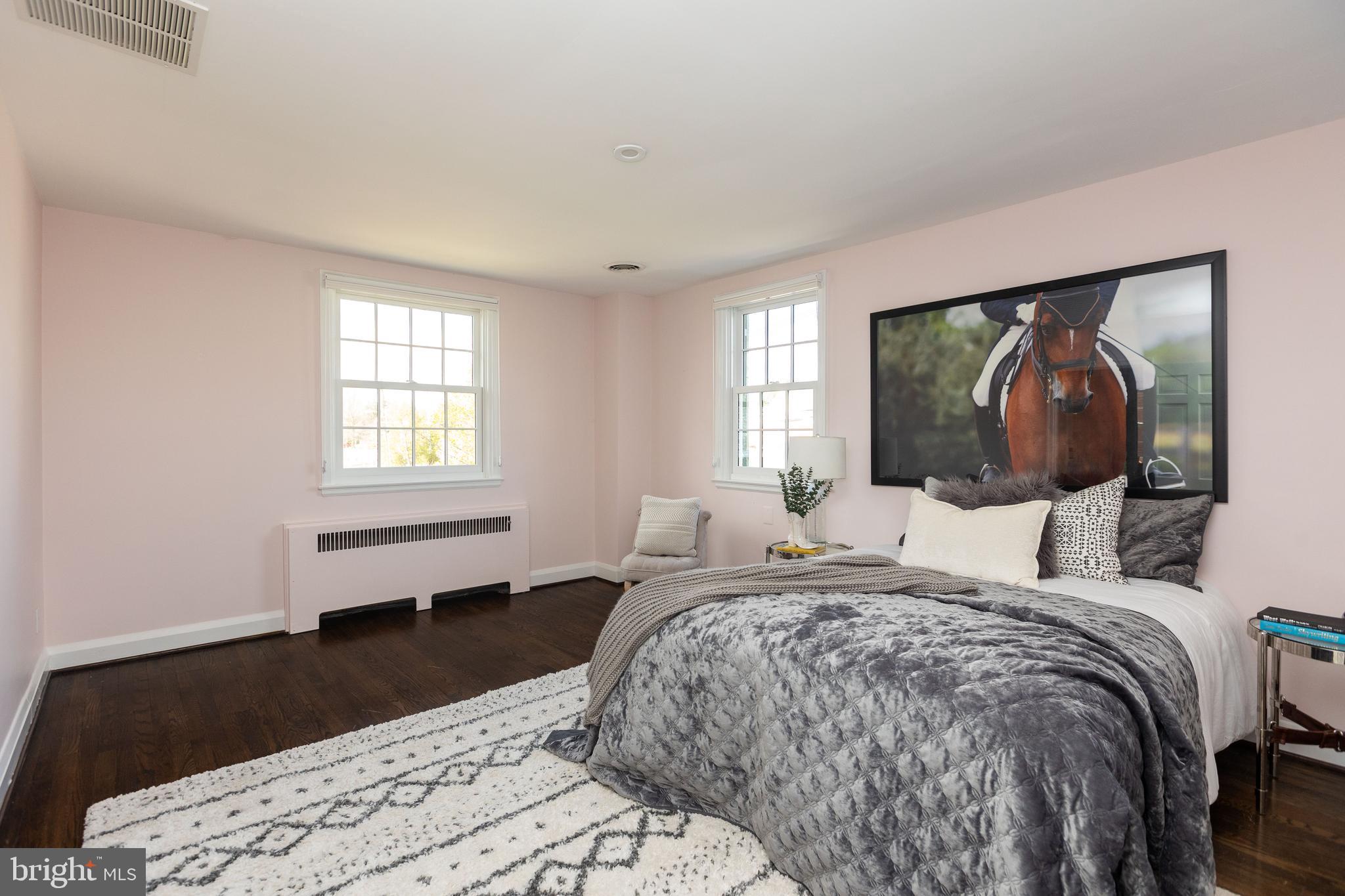 331 Broxton Road Baltimore, MD 21212 - Photo 33 of 58 a bedroom with a bed and a painting on the wall