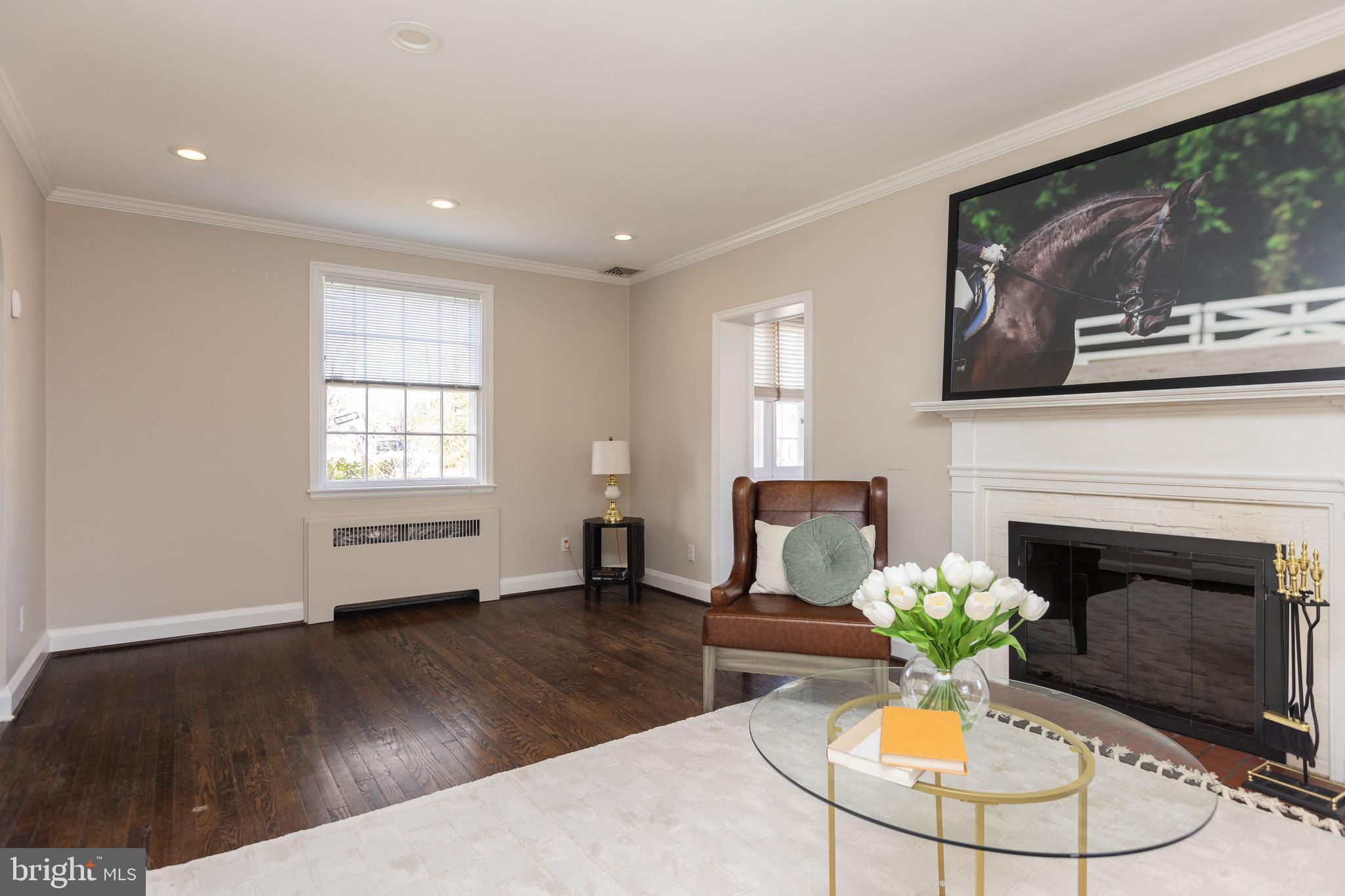 331 Broxton Road Baltimore, MD 21212 - Photo 5 of 58 a living room with furniture a fireplace and a flat screen tv