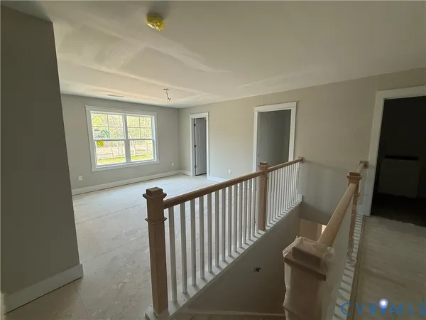 a view of a porch with wooden floor