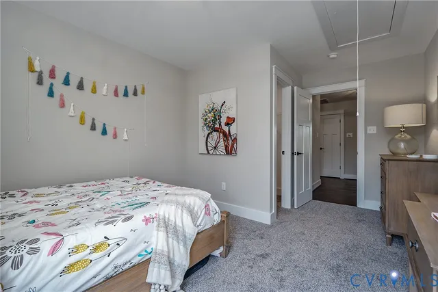 a bedroom with a bed and a view of bathroom