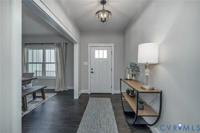 a view of a livingroom with furniture and wooden floor
