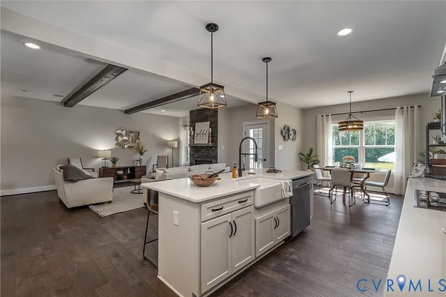 a view of living room with granite countertop furniture and a chandelier