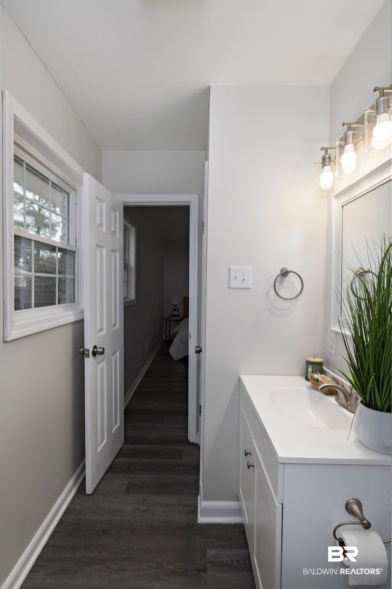 5922 Sunnyside Drive Mobile, AL 36619 - Photo 37 of 51 Bathroom featuring baseboards, vanity, and wood finished floors