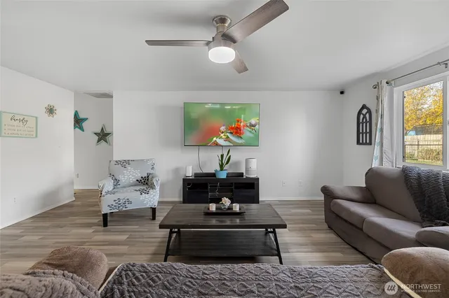 a living room with furniture and a rug
