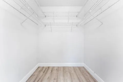 a view of a room with racks on the wall