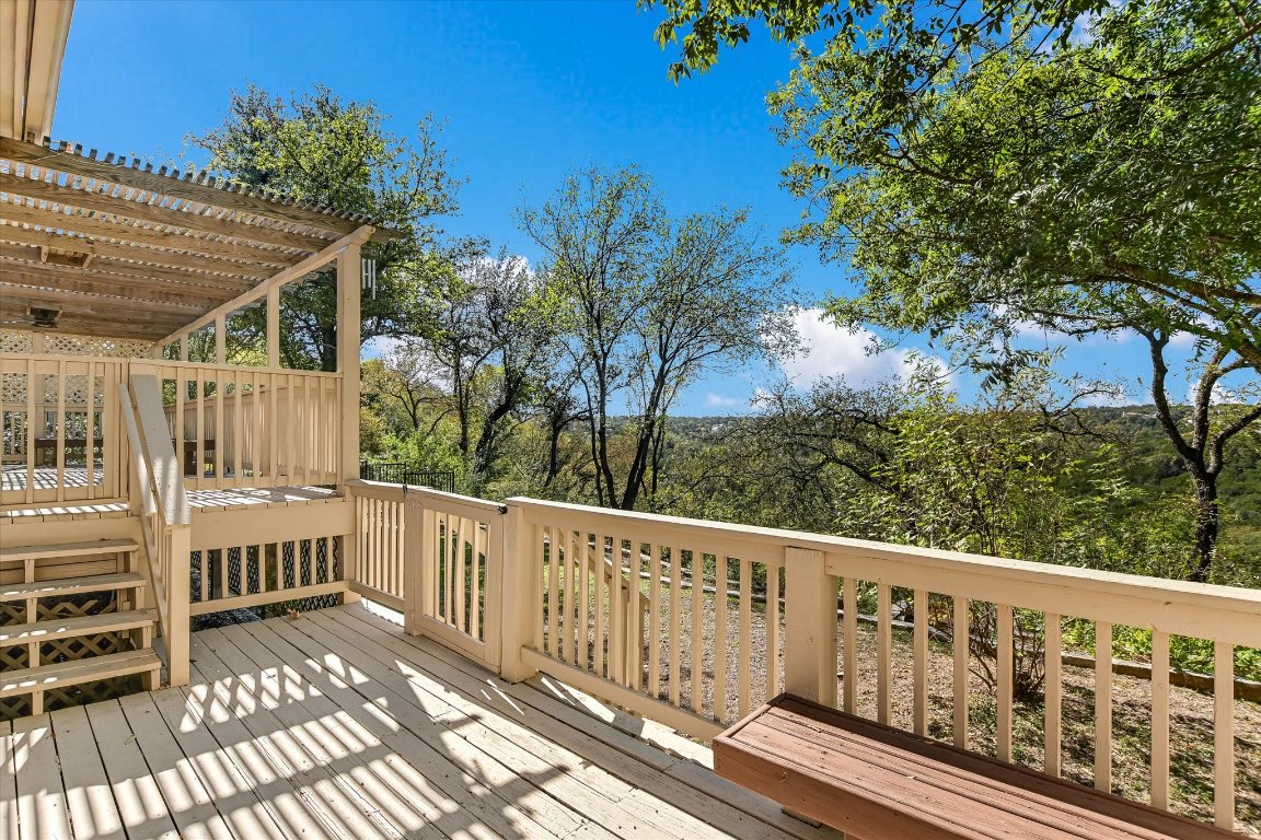 4819 Spicewood Springs Road Austin, TX 78759 - Photo 19 of 20 a view of a balcony with wooden floor and fence