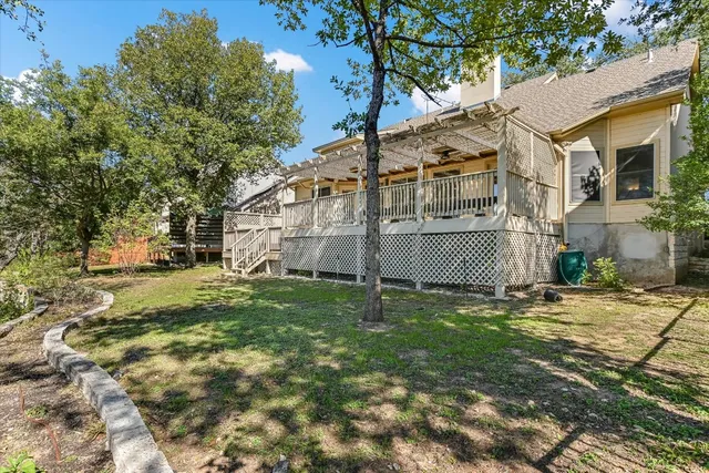 a view of a back yard of the house
