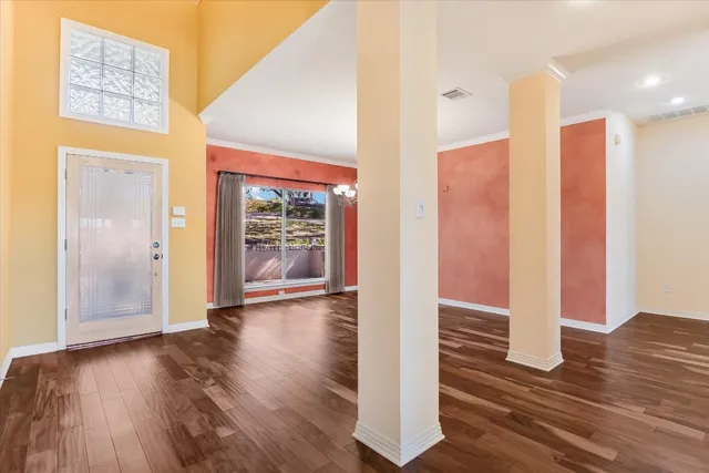 a view of front door with wooden floor