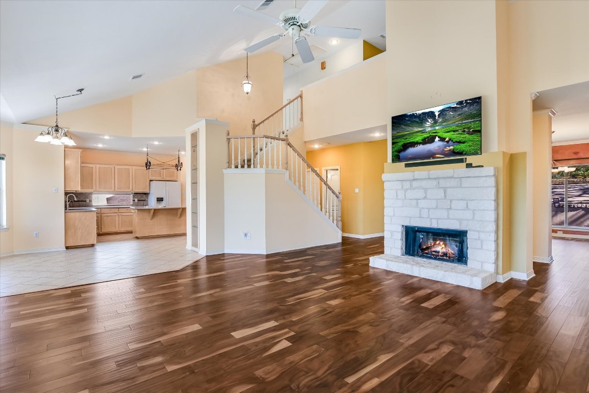 4819 Spicewood Springs Road Austin, TX 78759 - Photo 5 of 20 a view of a livingroom with a fireplace wooden floor and fire place