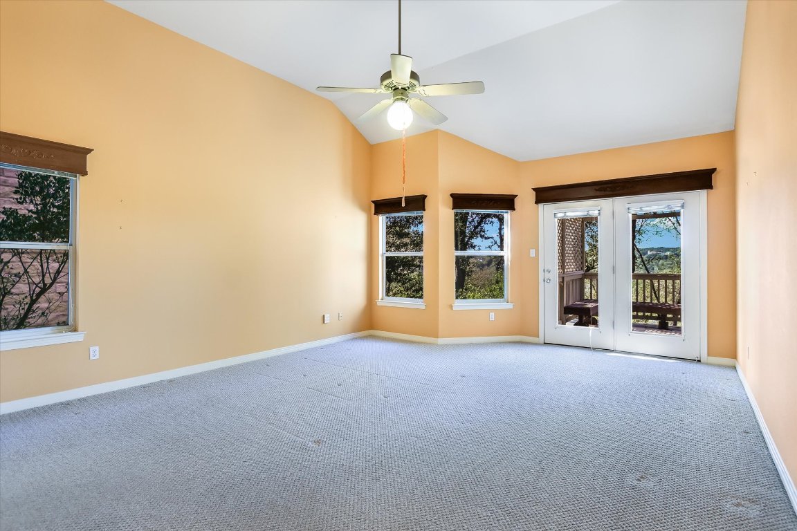 4819 Spicewood Springs Road Austin, TX 78759 - Photo 10 of 20 a view of an empty room with window and cabinet