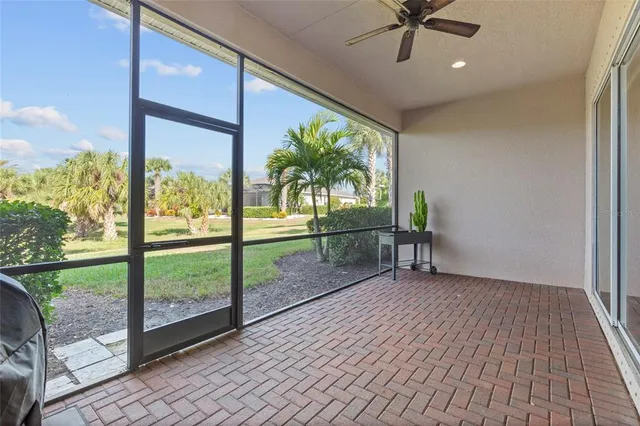 a view of a porch with wooden floor and a table