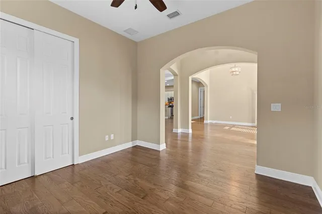 a view of a room with wooden floor