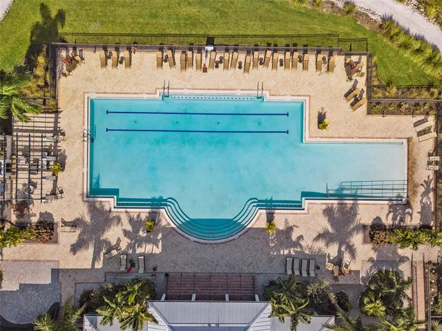 a view of a swimming pool with a table and chairs