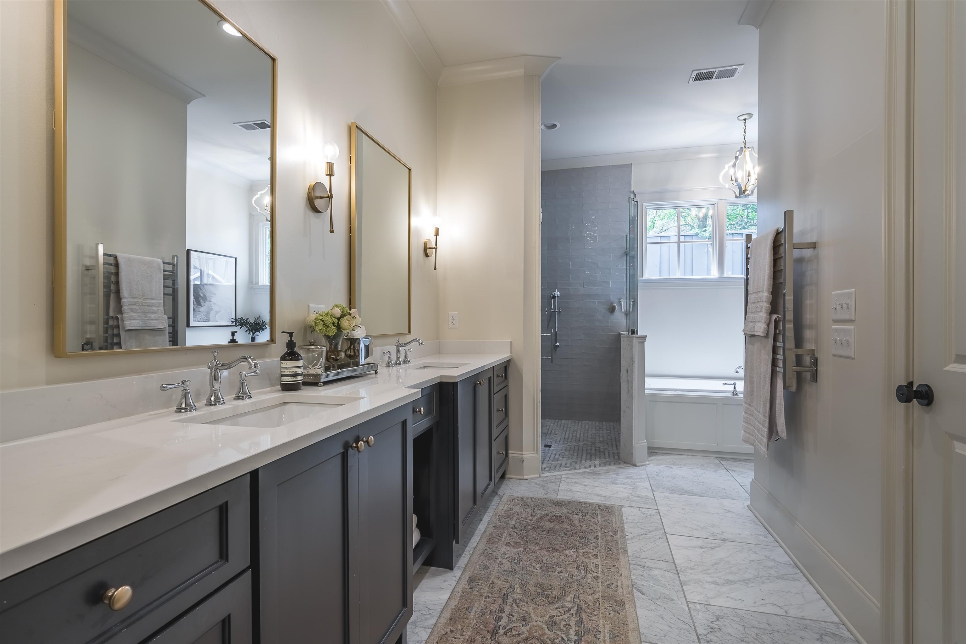 4764 Barfield Road Memphis, TN 38117 - Photo 12 of 25 a bathroom with a double vanity sink mirror and shower