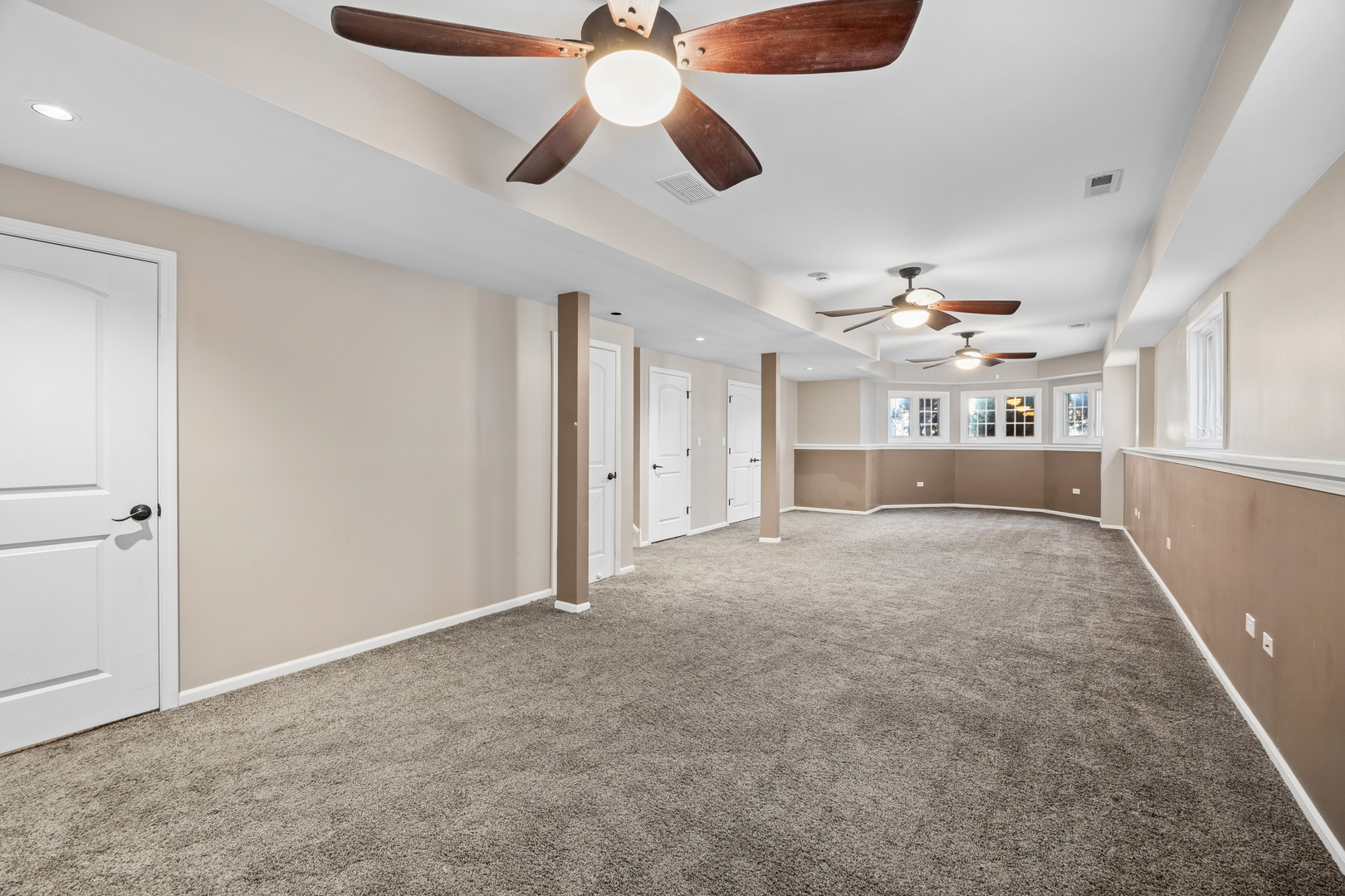 4103 Wisconsin Avenue Stickney, IL 60402 - Photo 14 of 24 an empty room with ceiling fan and windows