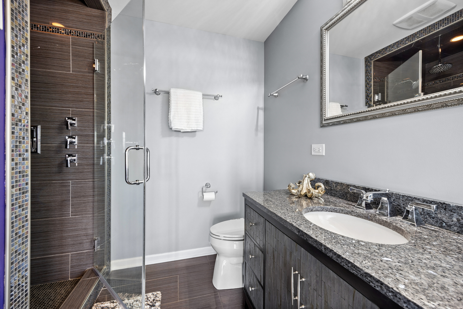 4103 Wisconsin Avenue Stickney, IL 60402 - Photo 9 of 24 a bathroom with a granite countertop sink a toilet and shower
