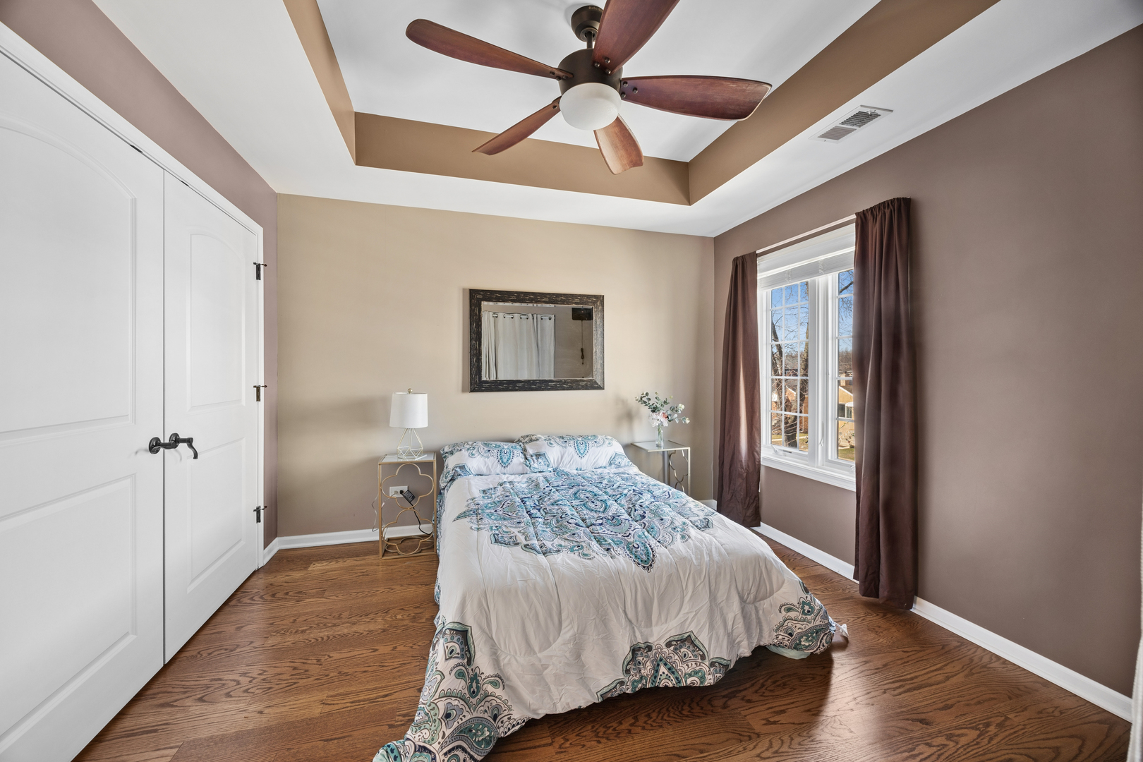 4103 Wisconsin Avenue Stickney, IL 60402 - Photo 10 of 24 a bedroom with a bed and a ceiling fan