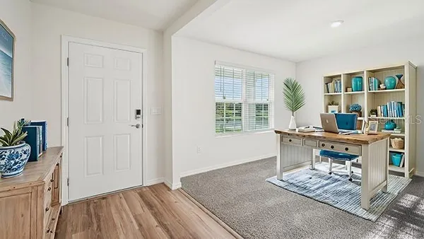 a workspace with furniture and window