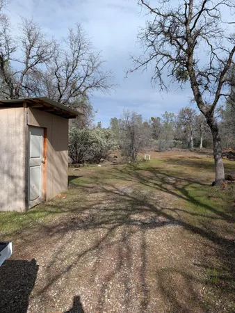 a view of a chairs and table in patio