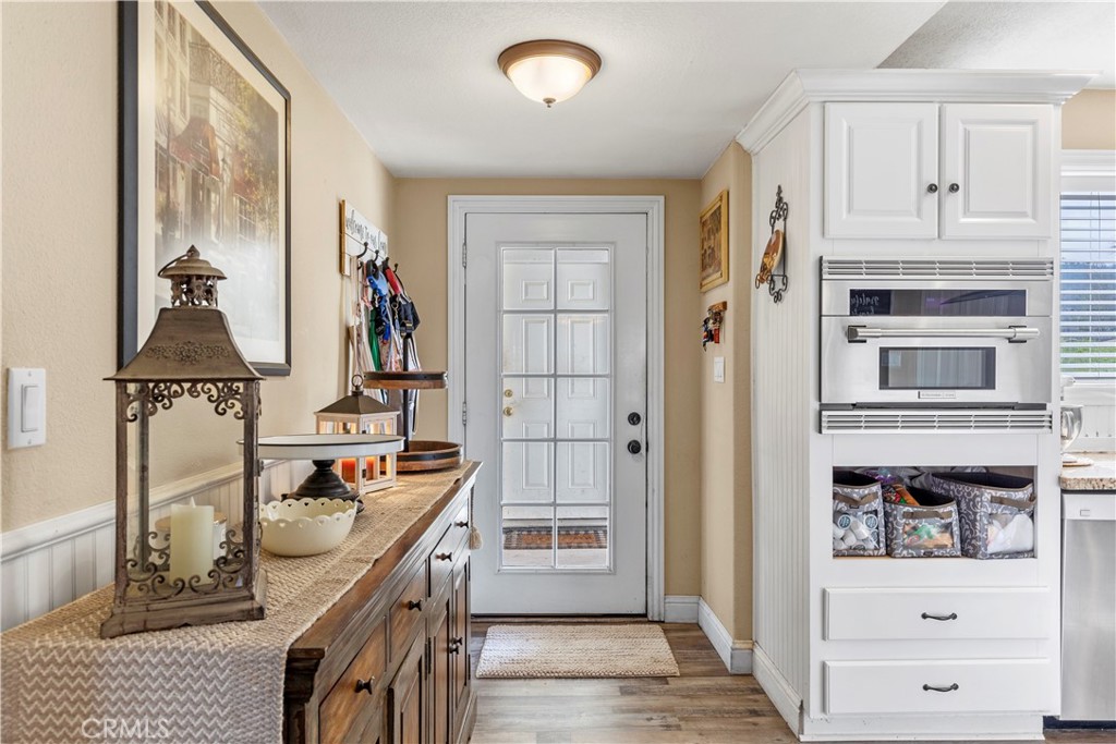 28841 Delaware Drive Tehachapi, CA 93561 - Photo 11 of 36 a kitchen with stainless steel appliances granite countertop a stove and a refrigerator