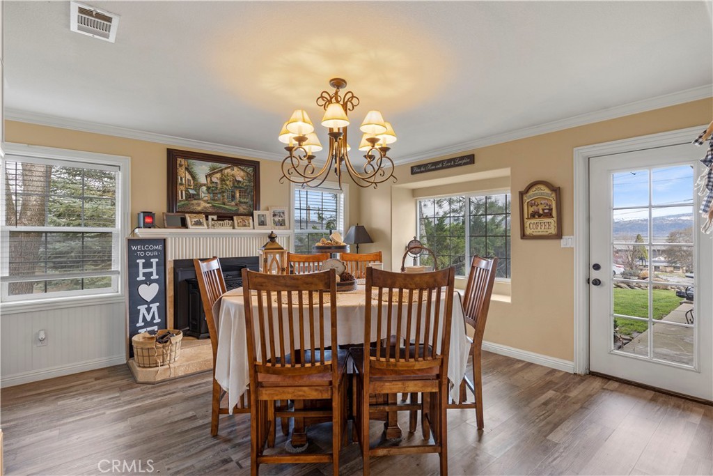 28841 Delaware Drive Tehachapi, CA 93561 - Photo 16 of 36 a view of a dining room with furniture window and wooden floor