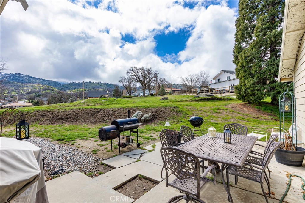 28841 Delaware Drive Tehachapi, CA 93561 - Photo 23 of 36 a view of a table and chairs in the garden