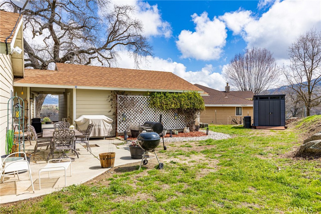 28841 Delaware Drive Tehachapi, CA 93561 - Photo 25 of 36 a view of a house with backyard porch and sitting area