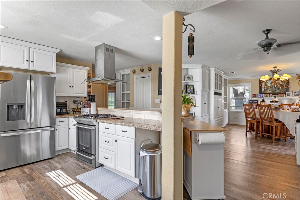 28841 Delaware Drive Tehachapi, CA 93561 - Photo 8 of 36 a kitchen with cabinets and stainless steel appliances