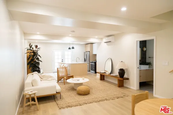 a living room with furniture and a table