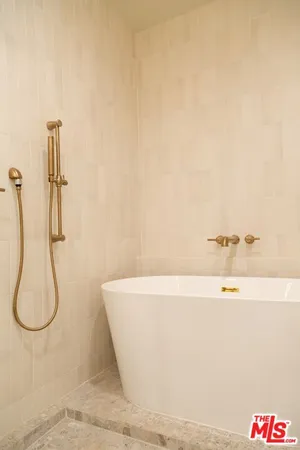 a white bath tub sitting in a bathroom