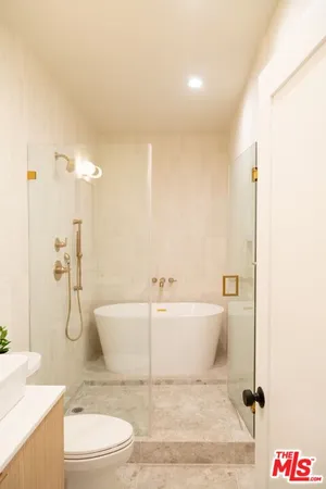 a bathroom with a sink a toilet and bathtub