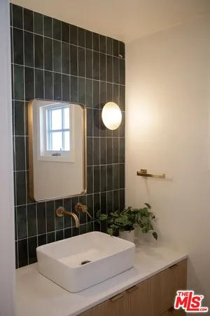 a bathroom with a sink and a shower