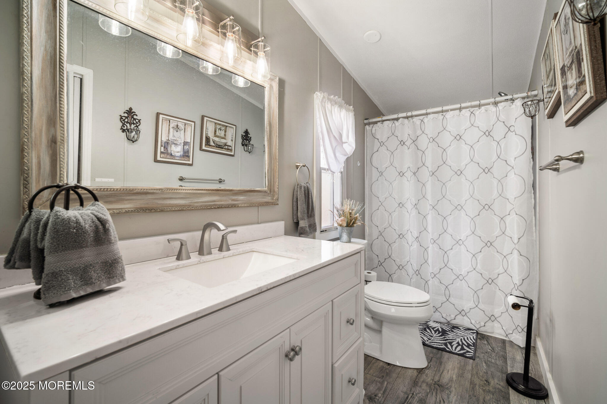 4 Oak Tree Lane Manahawkin, NJ 08050 - Photo 12 of 16 a bathroom with a sink a toilet and a mirror