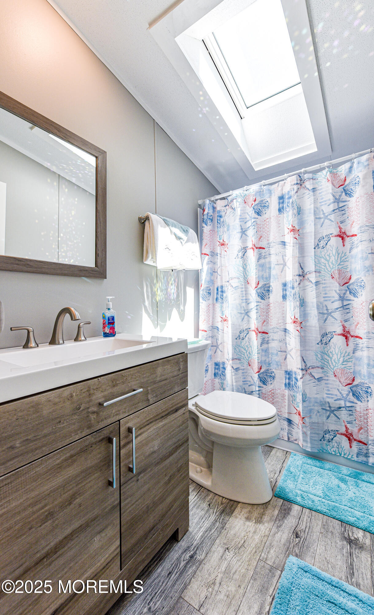 4 Oak Tree Lane Manahawkin, NJ 08050 - Photo 14 of 16 a bathroom with a sink mirror and toilet
