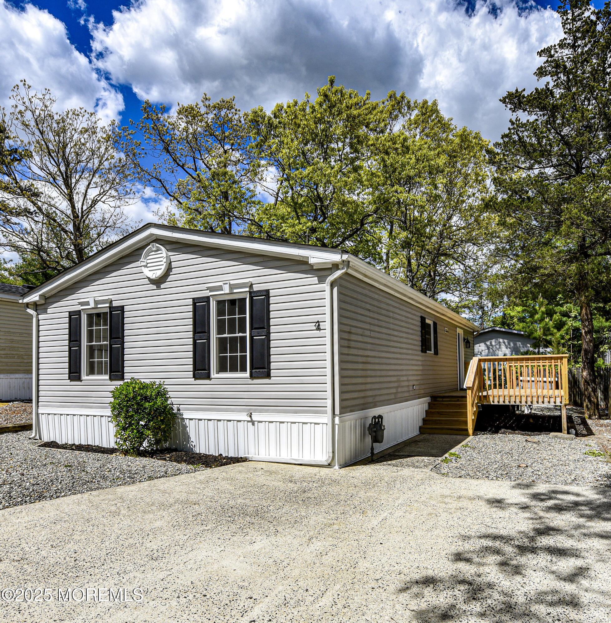 4 Oak Tree Lane Manahawkin, NJ 08050 - Photo 15 of 16 a view of a house with a yard