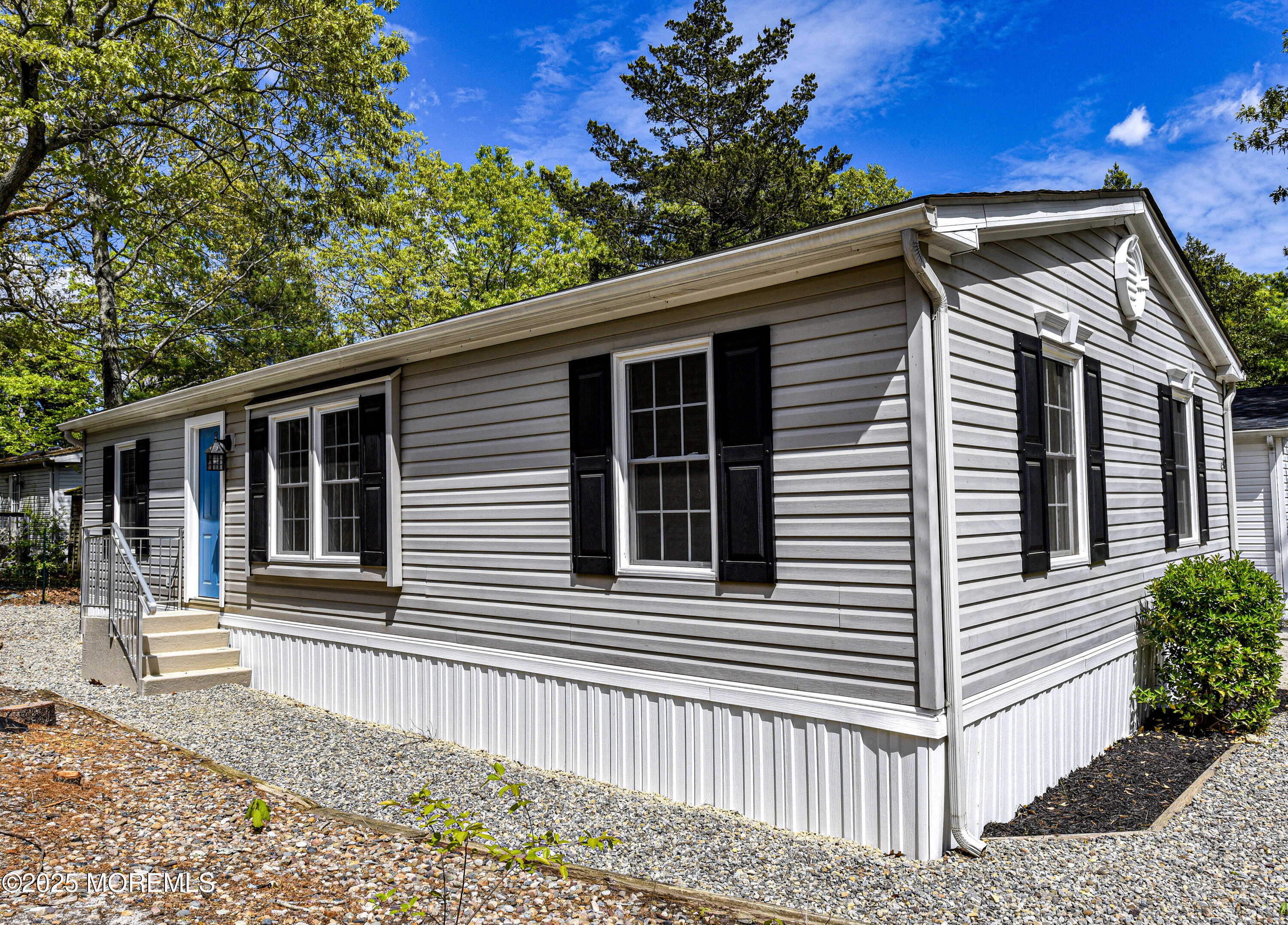 4 Oak Tree Lane Manahawkin, NJ 08050 - Photo 16 of 16 a view of a house and a yard