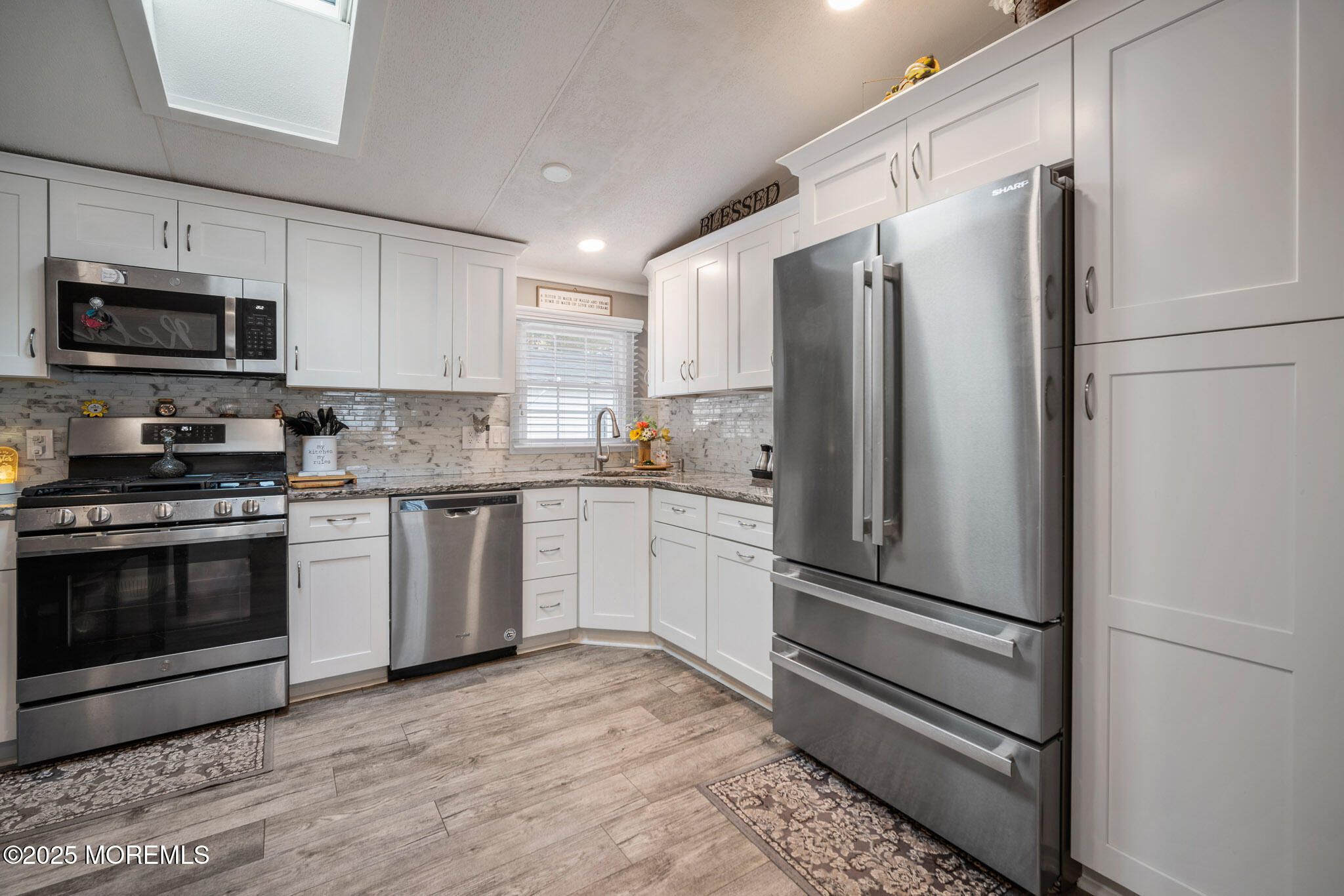 4 Oak Tree Lane Manahawkin, NJ 08050 - Photo 4 of 16 a kitchen with stainless steel appliances and granite countertop a refrigerator stove