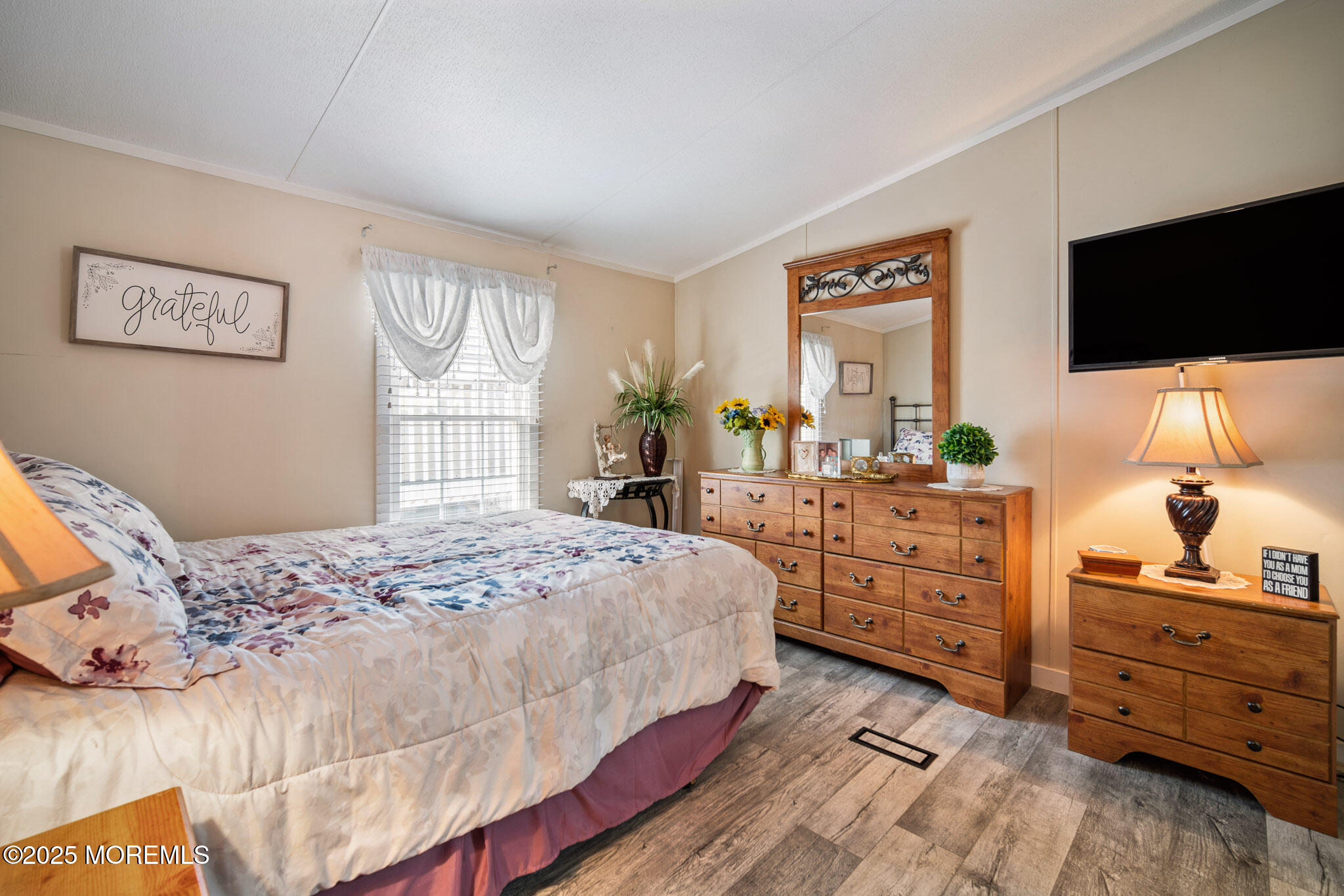4 Oak Tree Lane Manahawkin, NJ 08050 - Photo 9 of 16 a bedroom with a large bed and flat tv screen on dresser