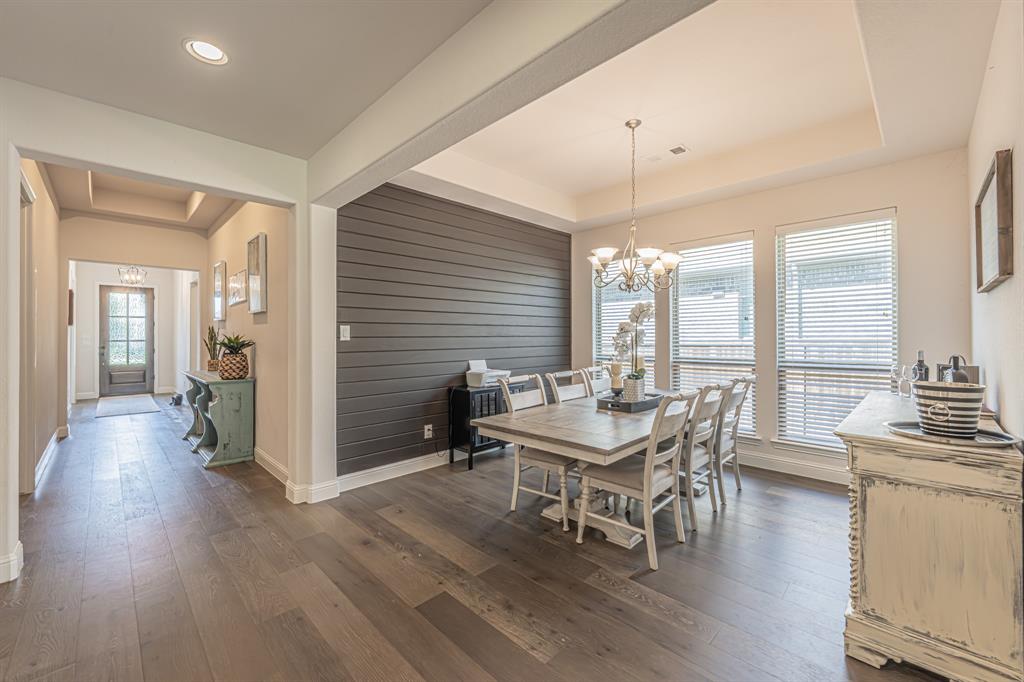 1610 Gardenia Street Prosper, TX 75078 - Photo 16 of 36 a dining room with furniture window and wooden floor