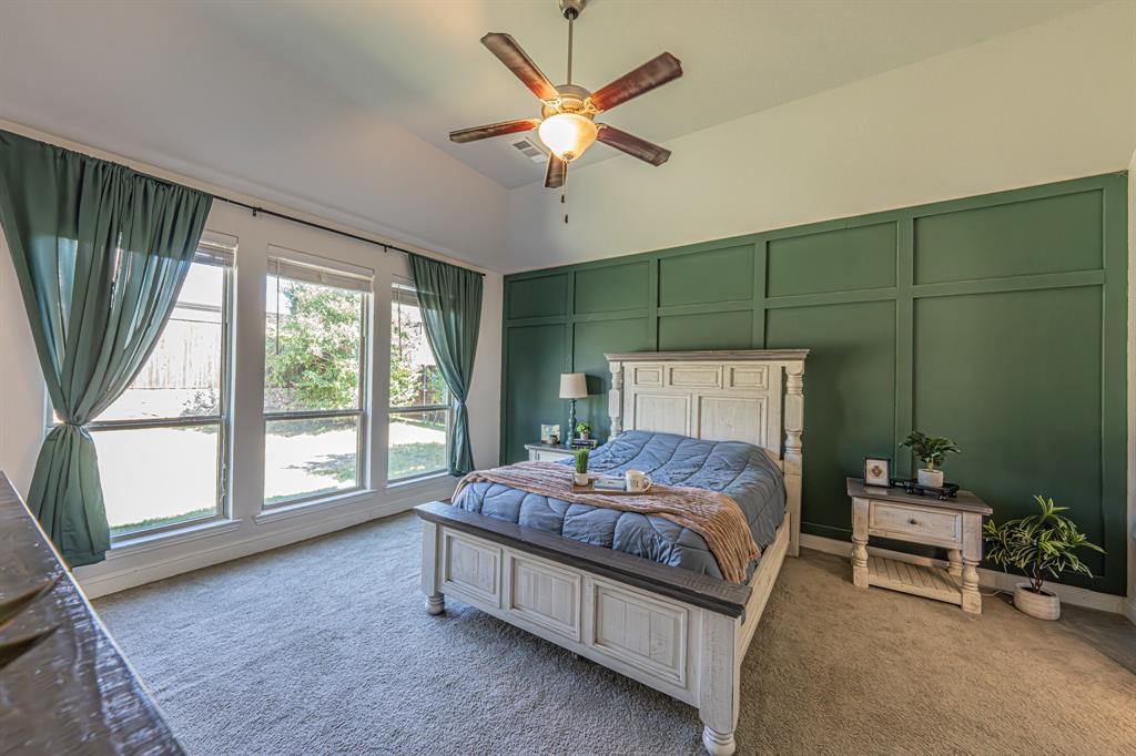 1610 Gardenia Street Prosper, TX 75078 - Photo 18 of 36 a bedroom with a bed table and chairs