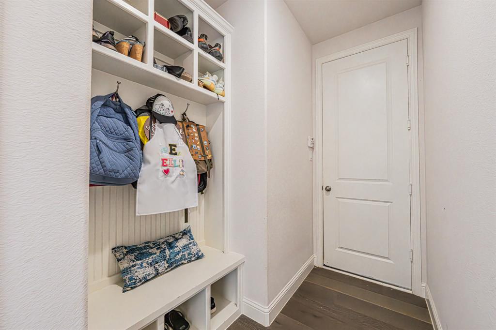 1610 Gardenia Street Prosper, TX 75078 - Photo 29 of 36 a view of walk in closet with clothes and shoes