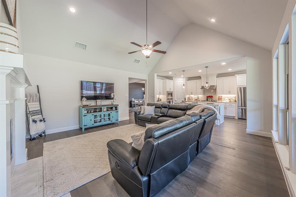 1610 Gardenia Street Prosper, TX 75078 - Photo 6 of 36 a living room with furniture a ceiling fan and a window