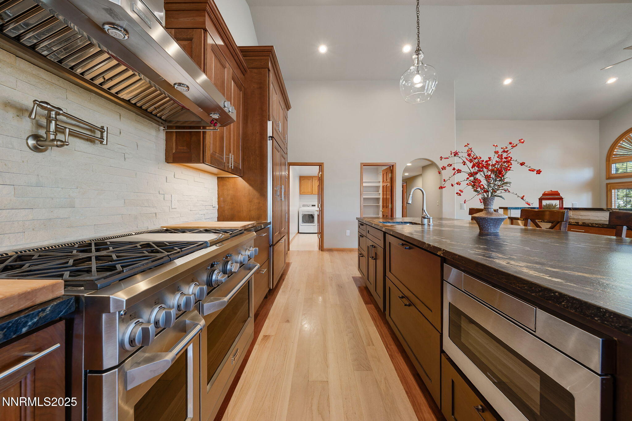 1205 Greensburg Circle Reno, NV 89509 - Photo 12 of 41 a kitchen with stainless steel appliances granite countertop a stove and a sink