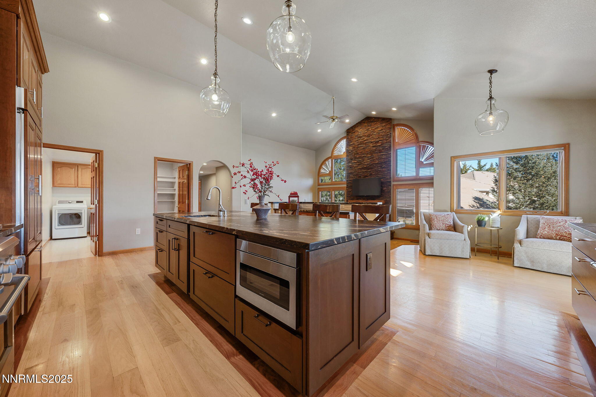 1205 Greensburg Circle Reno, NV 89509 - Photo 13 of 41 a view of living room kitchen with stainless steel appliances granite countertop living room and kitchen island